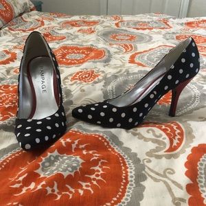 Black and white polka dot pumps with red heel.